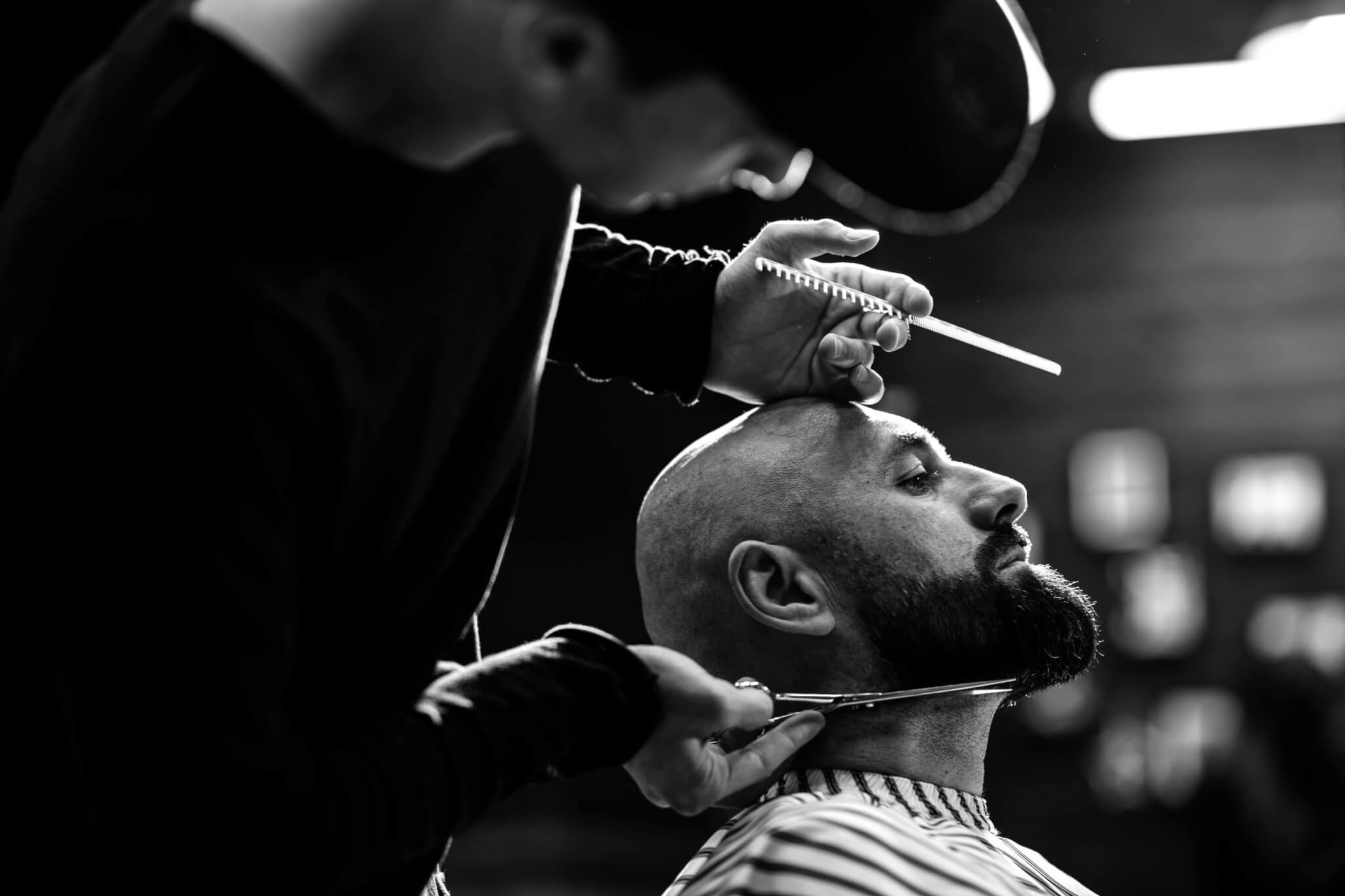 black-and-white-photo-fashion-barber-dressed-in-a-PAL2DCK-1.jpg
