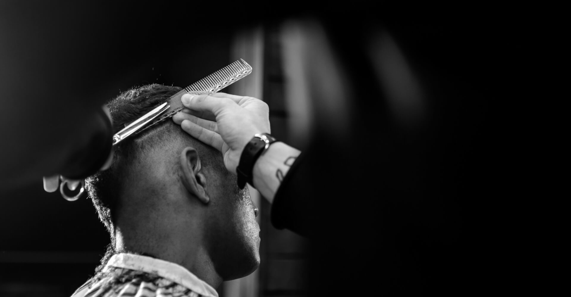 the-barber-scissors-hair-on-the-sides-for-a-stylis-AJ6M29G-1-1.jpg